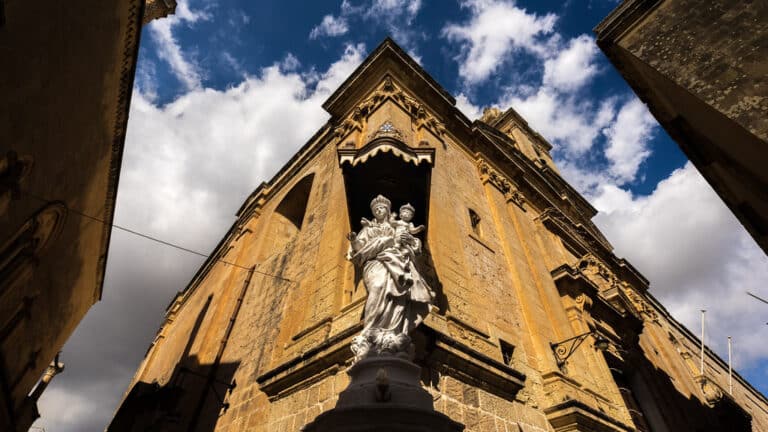 Quiet narrow street and historic church in Mdina, Malta during the off-season